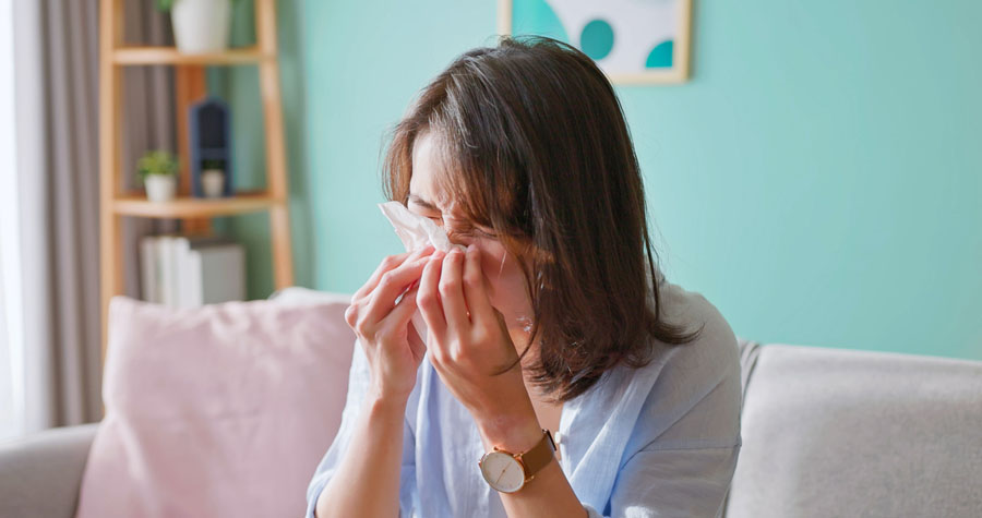 woman sick and sneeze
