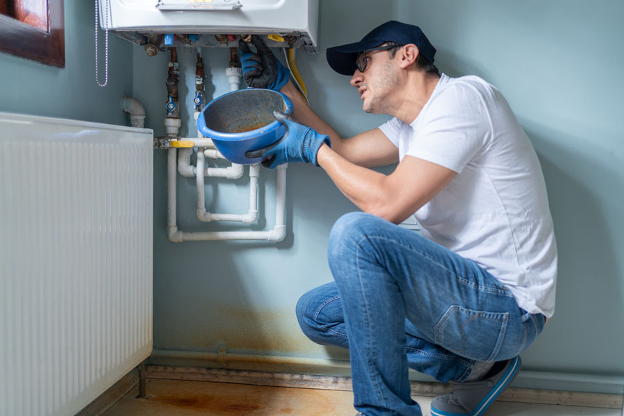 Man Looking At Water Leaking
