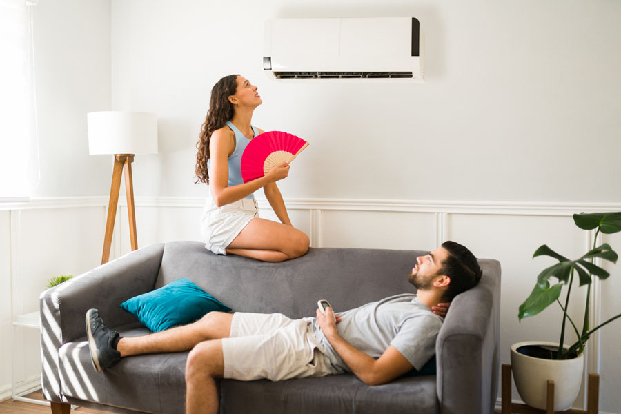 woman feeling hot and trying to cool down